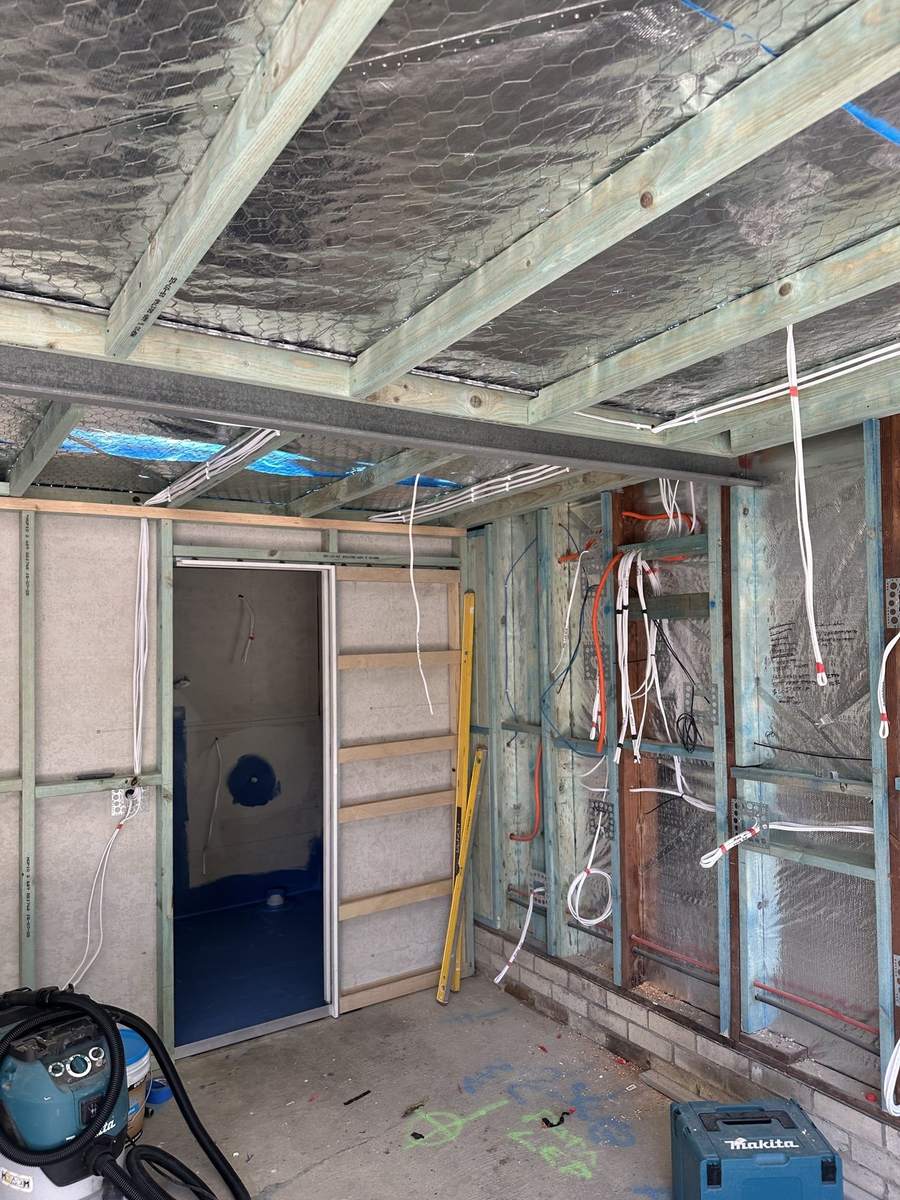 Electrical rough-in during a renovation, cabling run through open framing